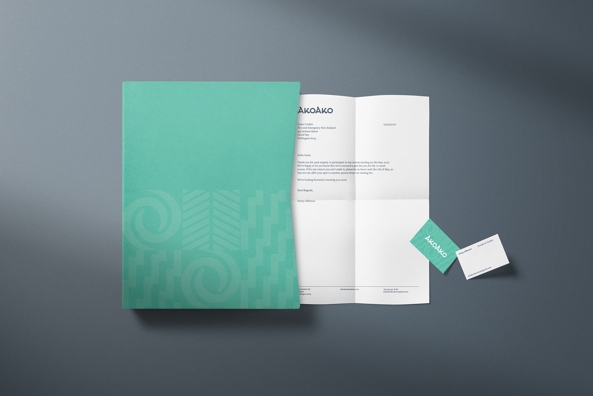 The image shows a folder, letterhead and business cards portraying Maori patterns for Akoako