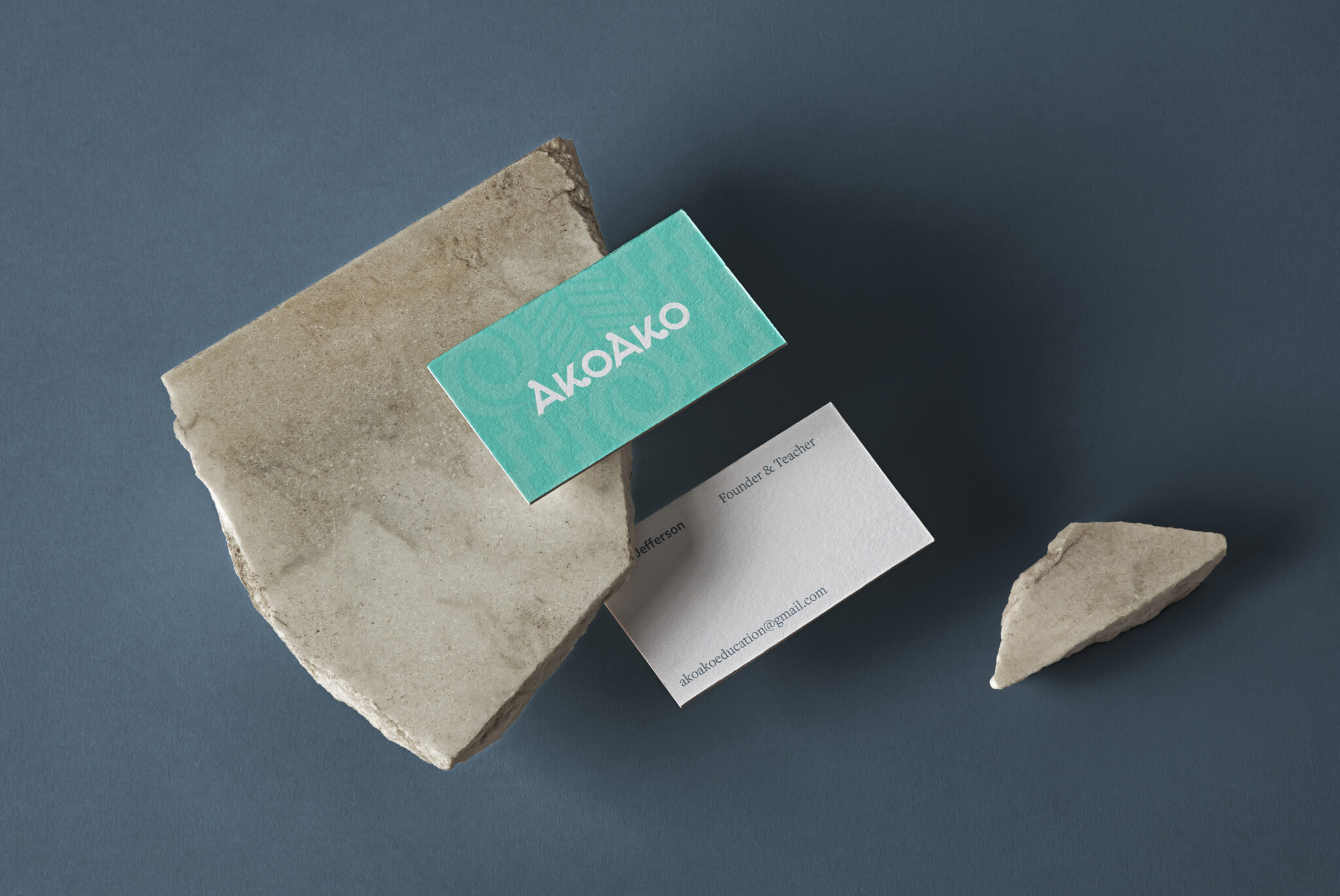 Mockup showing business card design in the Akoako Brand Identity