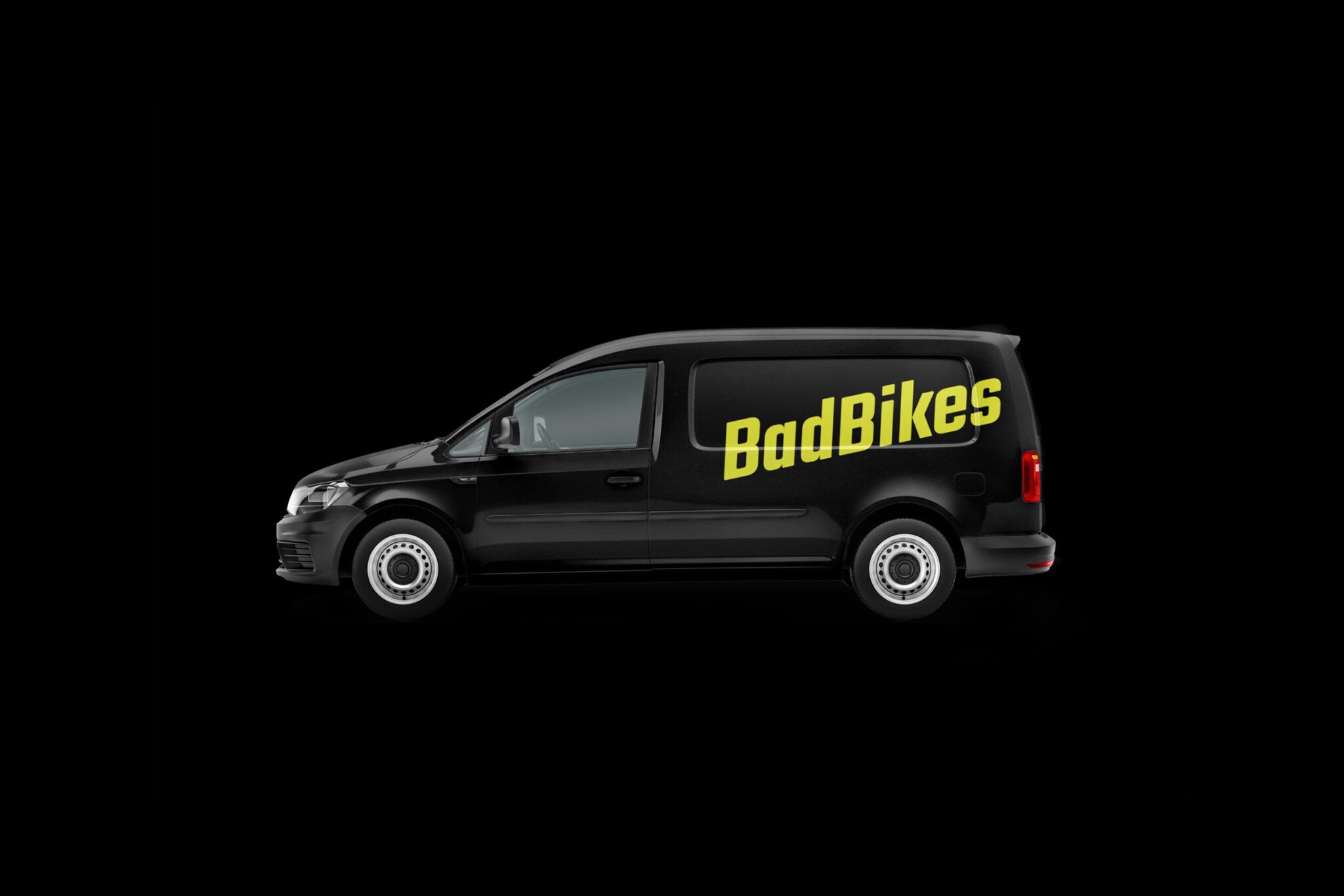 Black van on black background with a car signage that shows the Bad Bikes Berlin Logo
