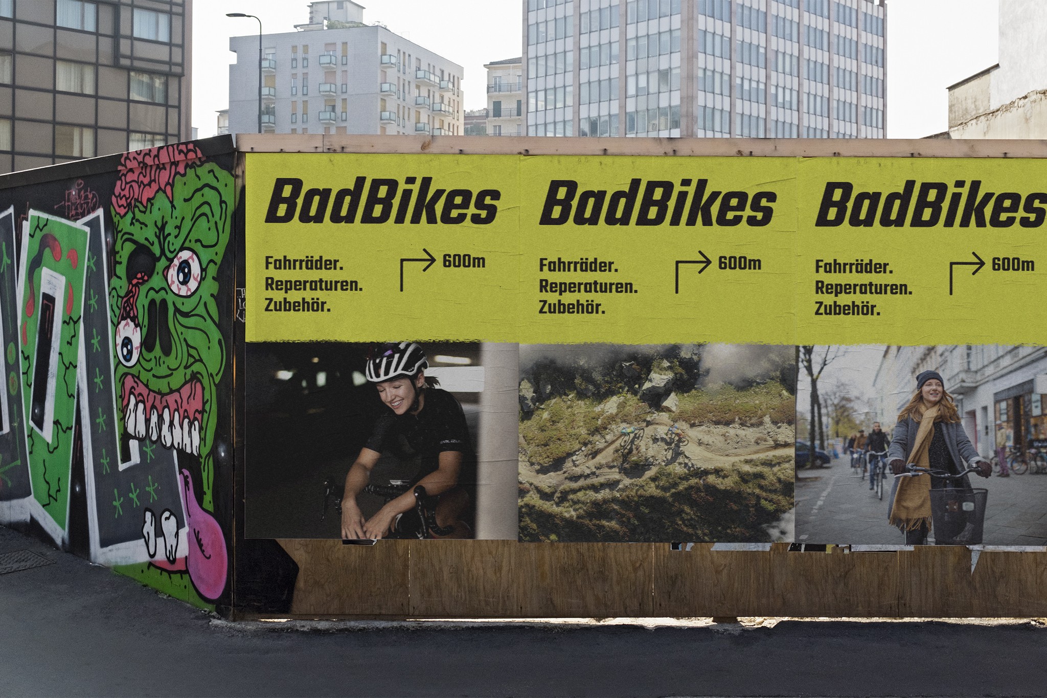 Image depicts three posters of an advertisement for a bicycle shop hanging on a construction fence. The posters feature the Bad Bikes Berlin logo, images and directions to find the shop.
