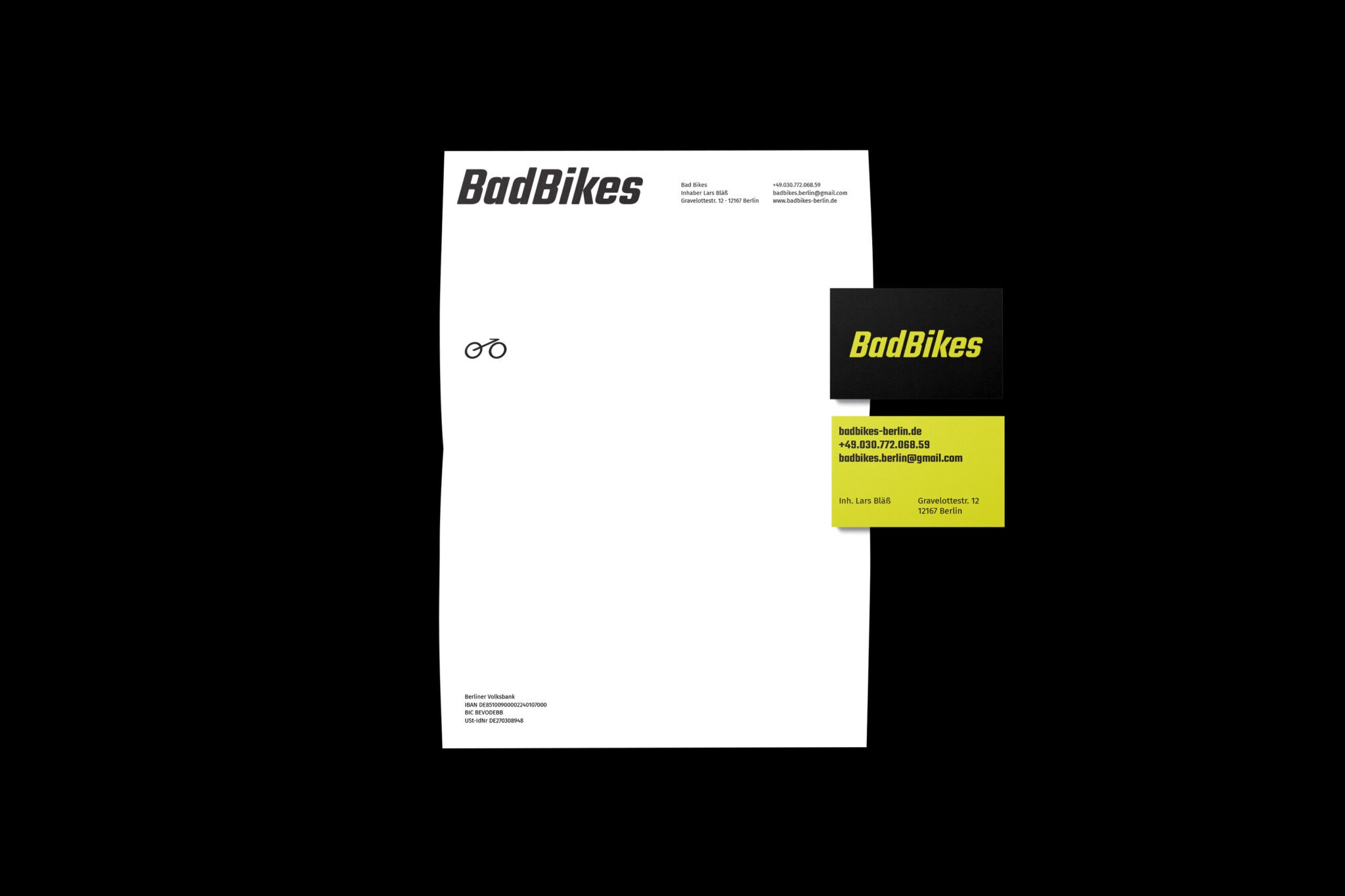 image shows letterhead and two business cards for Bad Bikes Berlin on black background. The letterhead features a bold logo and a small bike icon. The business card has a bright green background.