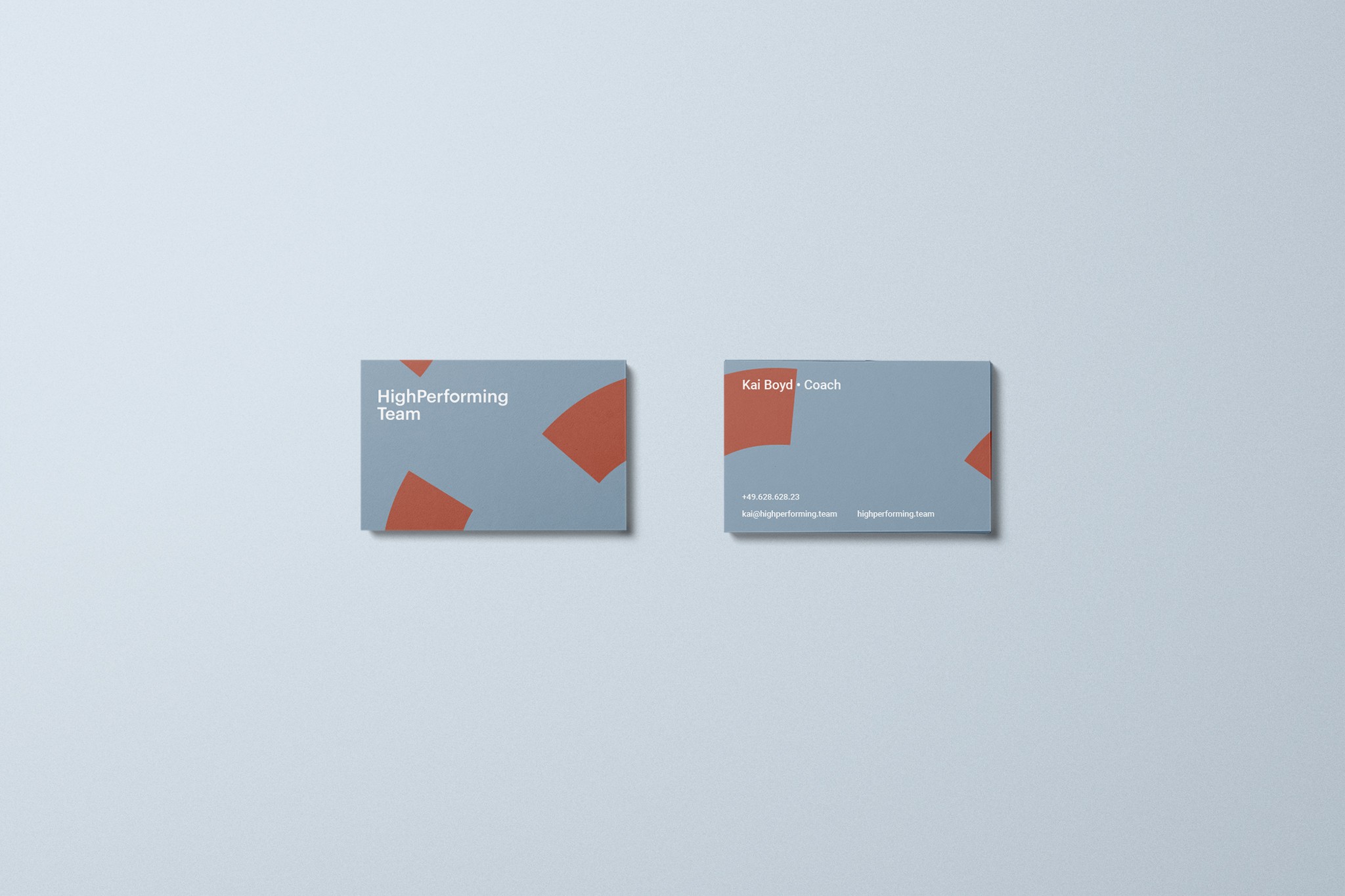 image shows a business card from the front and back using an exploded ring as decorative element