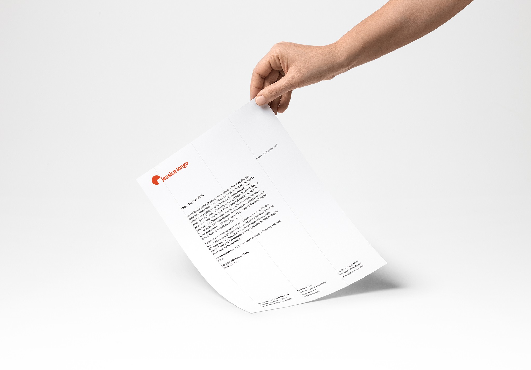 Hand holding letterhead portraying Jessica Longo‘s branding