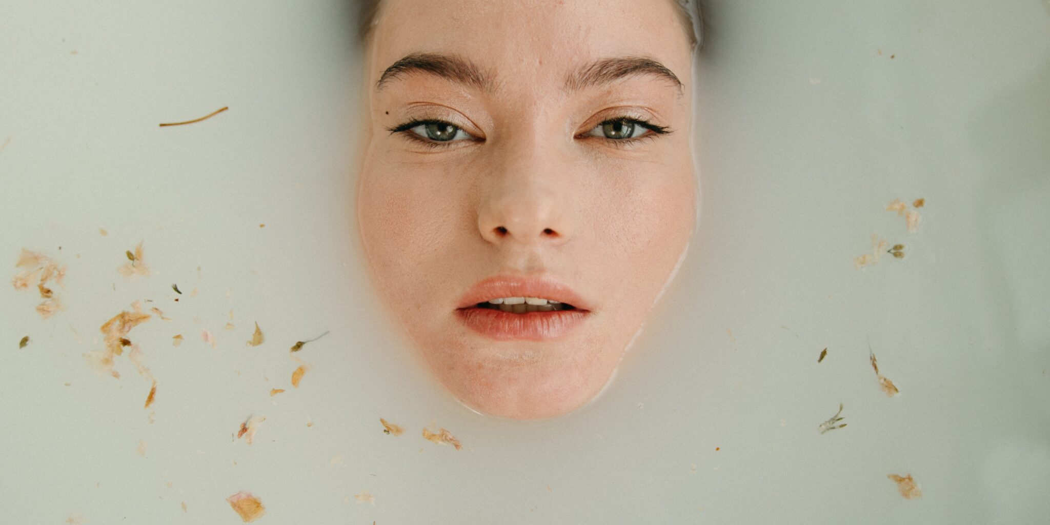 Woman immersed in a bath tub as an introduction image for a blog post about sensory branding
