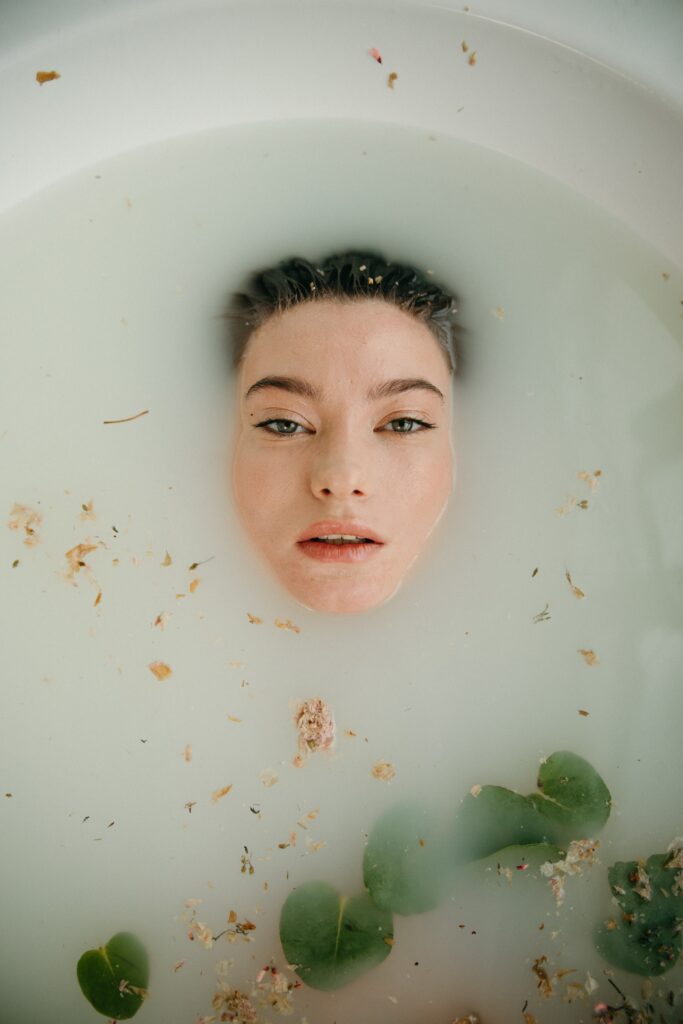 Woman immersed in a bath tub as an introduction image for a blog post about sensory branding