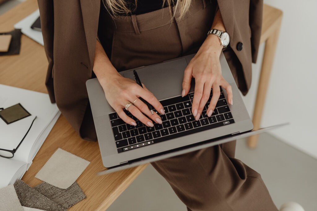 freelancer typing on her laptop