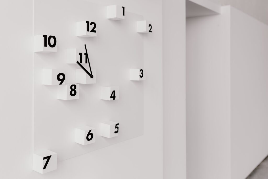 Image shows a clock with scattered numbers as a metaphor for measuring what makes a strong brand