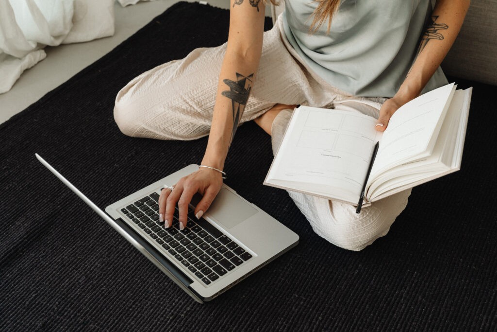 Picture of a woman on a laptop as the intro image for an blog articles titled "15 Reasons Why Your Brand Still Needs a Website in 2024"