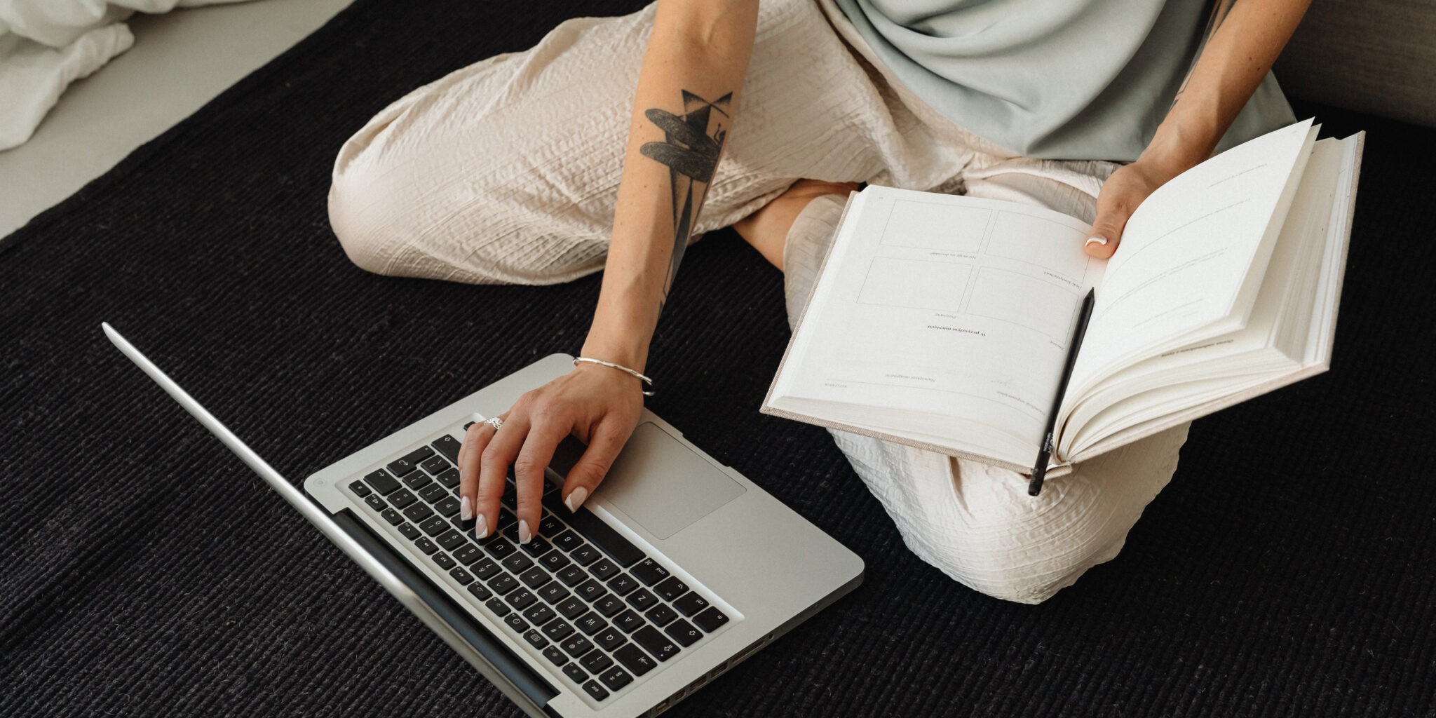 Picture of a woman on a laptop as the intro image for an blog articles titled "15 Reasons Why Your Brand Still Needs a Website in 2024"