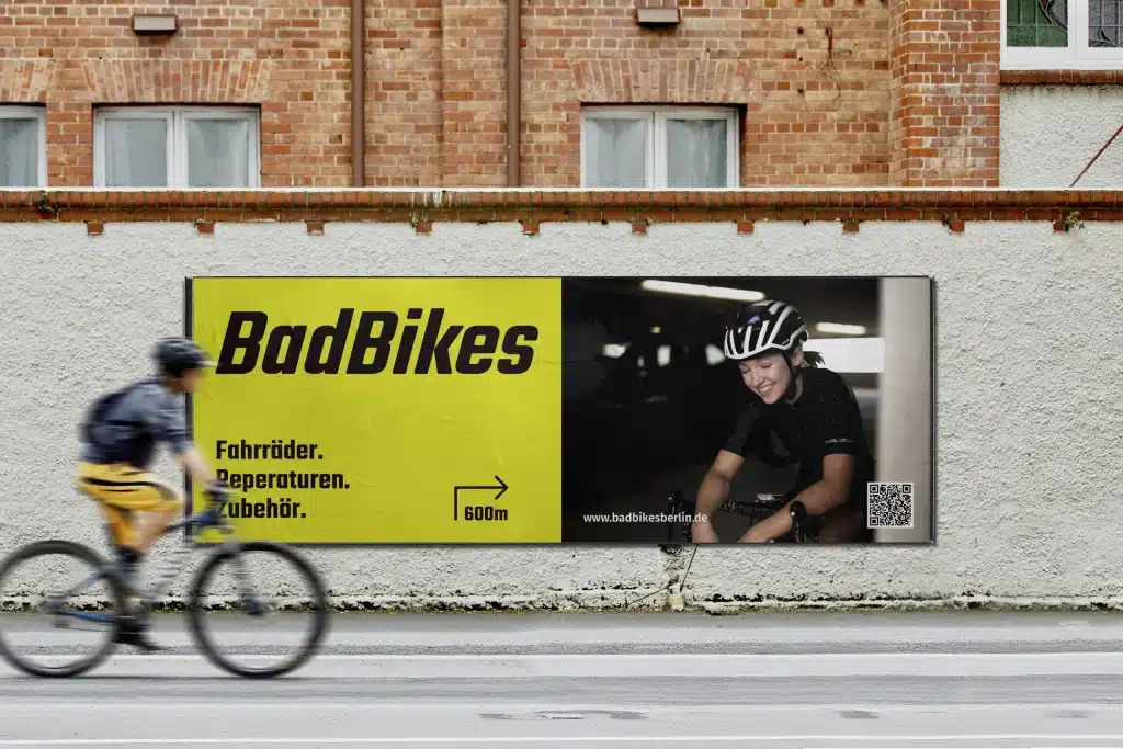 Bike shop branding for Bad Bikes Berlin — billboard mockup showing the brand identity applied to outdoor advertising.