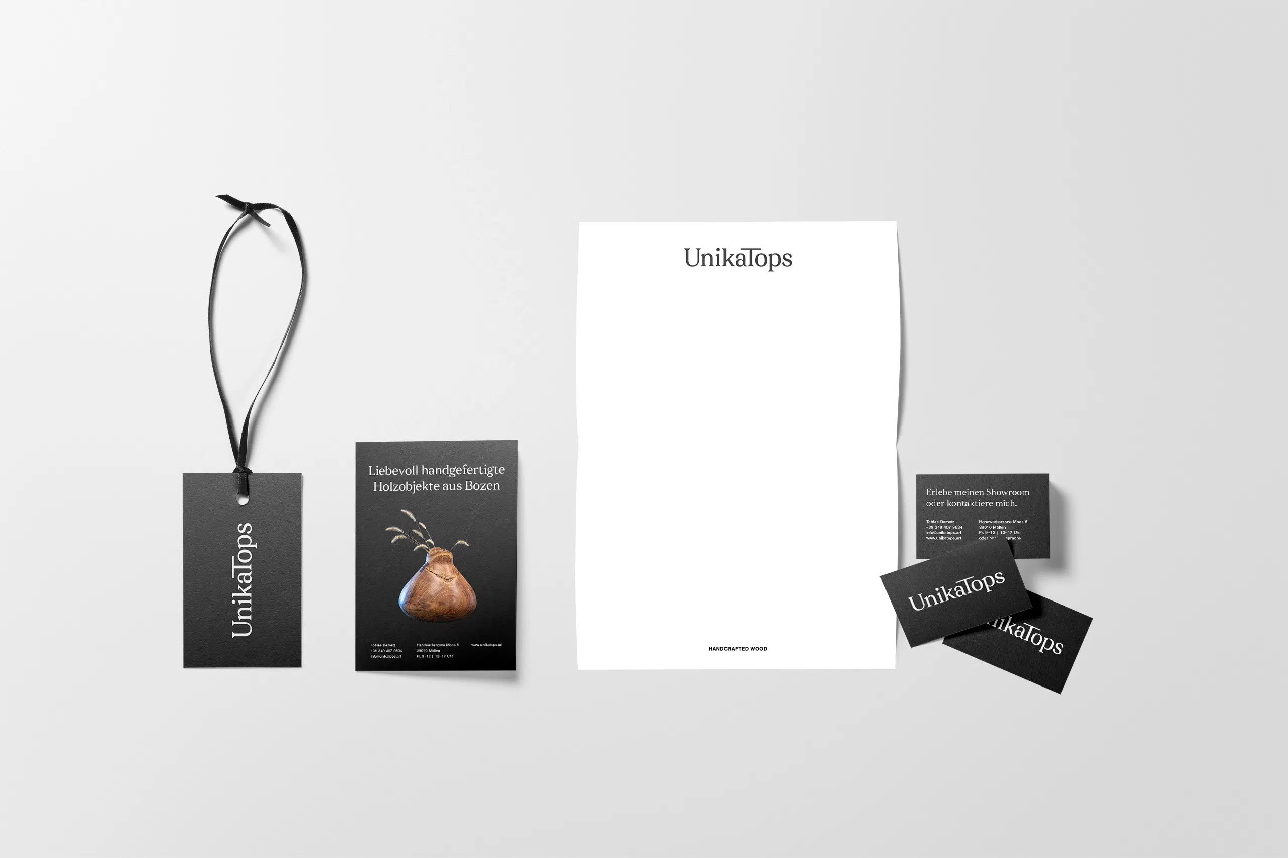 Brand Collateral I designed for UnikaTops: Letterhead, business cards, a flyer and tags.