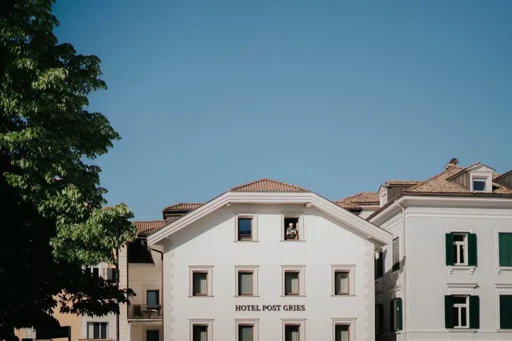 Front view of the Hotel Post Gries showing the façade design and signage, designed by Nine Blaess.