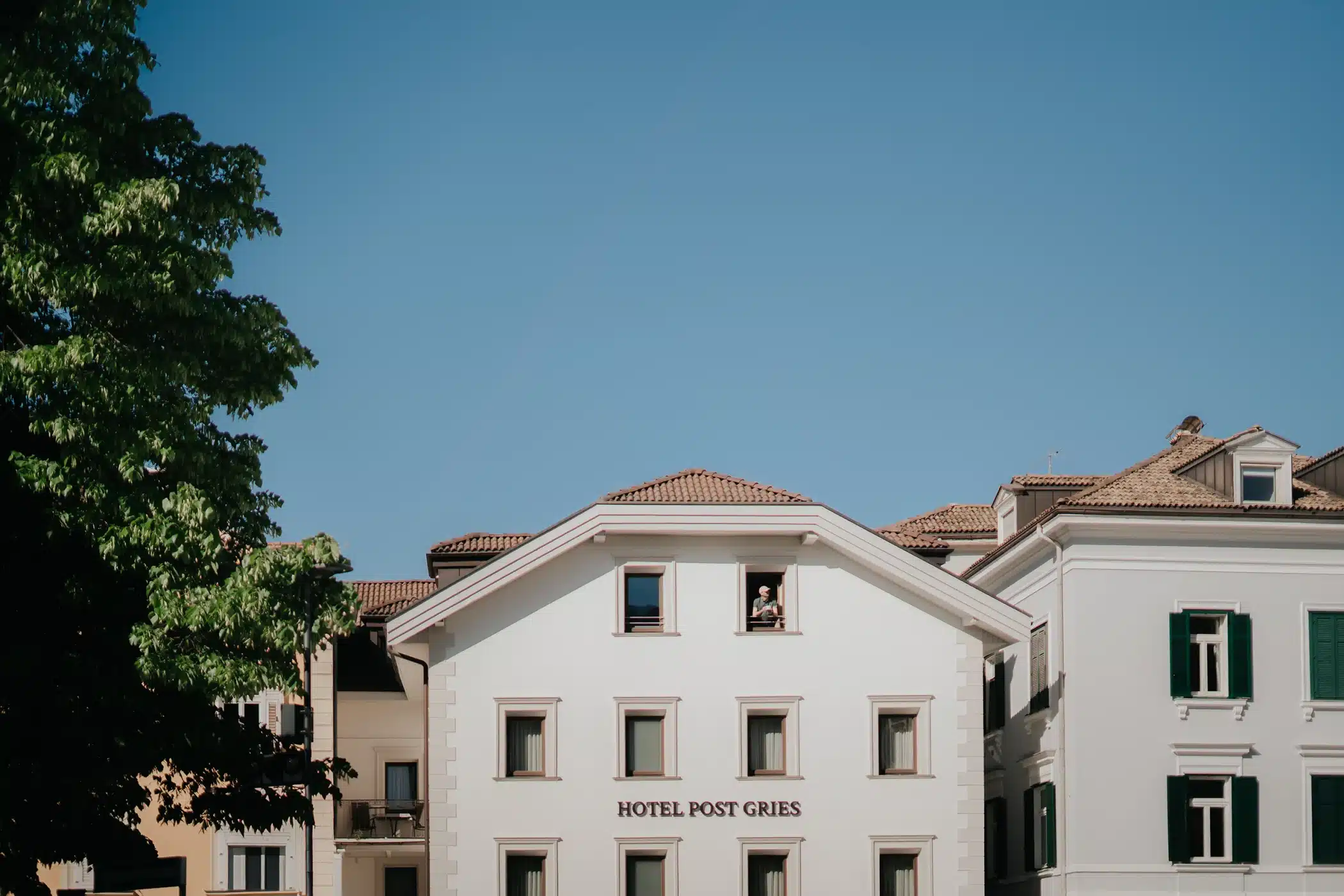Front view of the Hotel Post Gries showing the façade design and signage, designed by Nine Blaess.