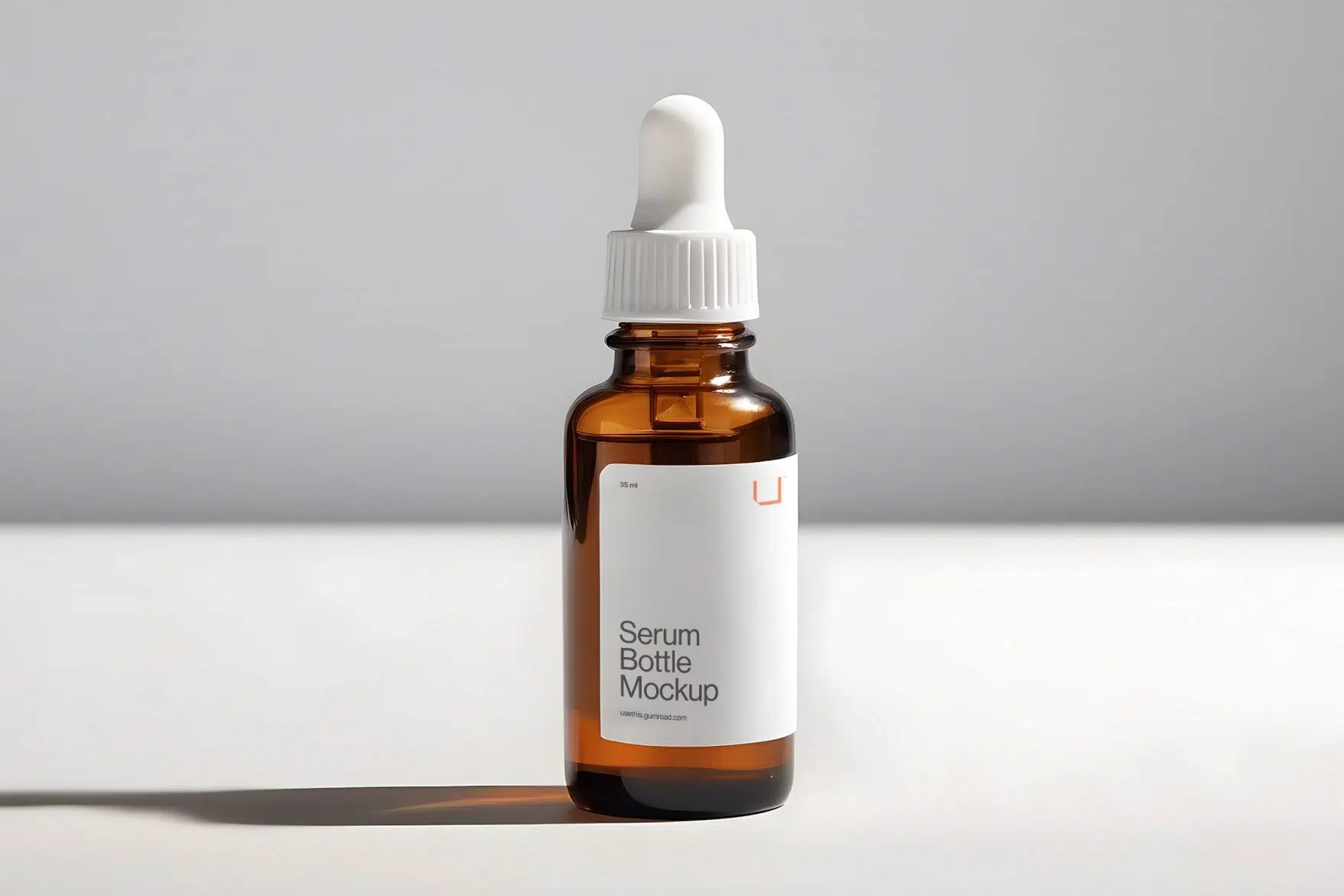 Free, or pay-what-you-want, serum bottle mockup by usethis Studio—found on the marketplace Gumroad