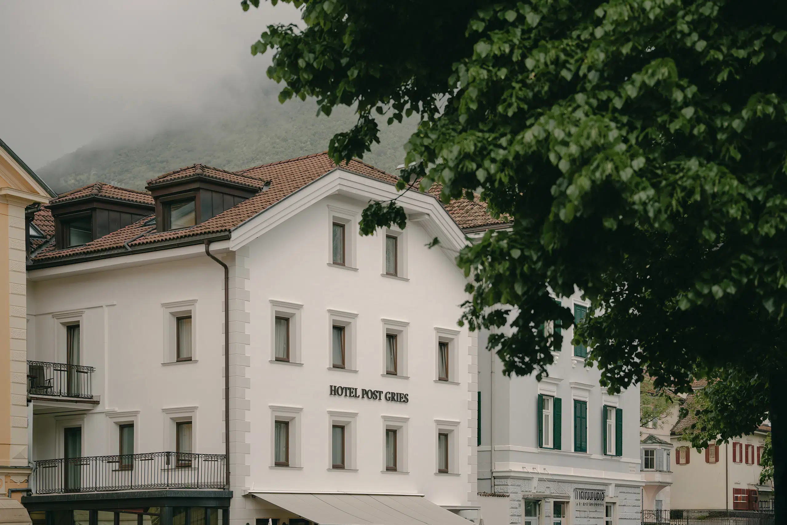 Facade of Hotel Post Gries showcasing the new signage design, created as part of the brand identity refresh for the historic post accommodation.