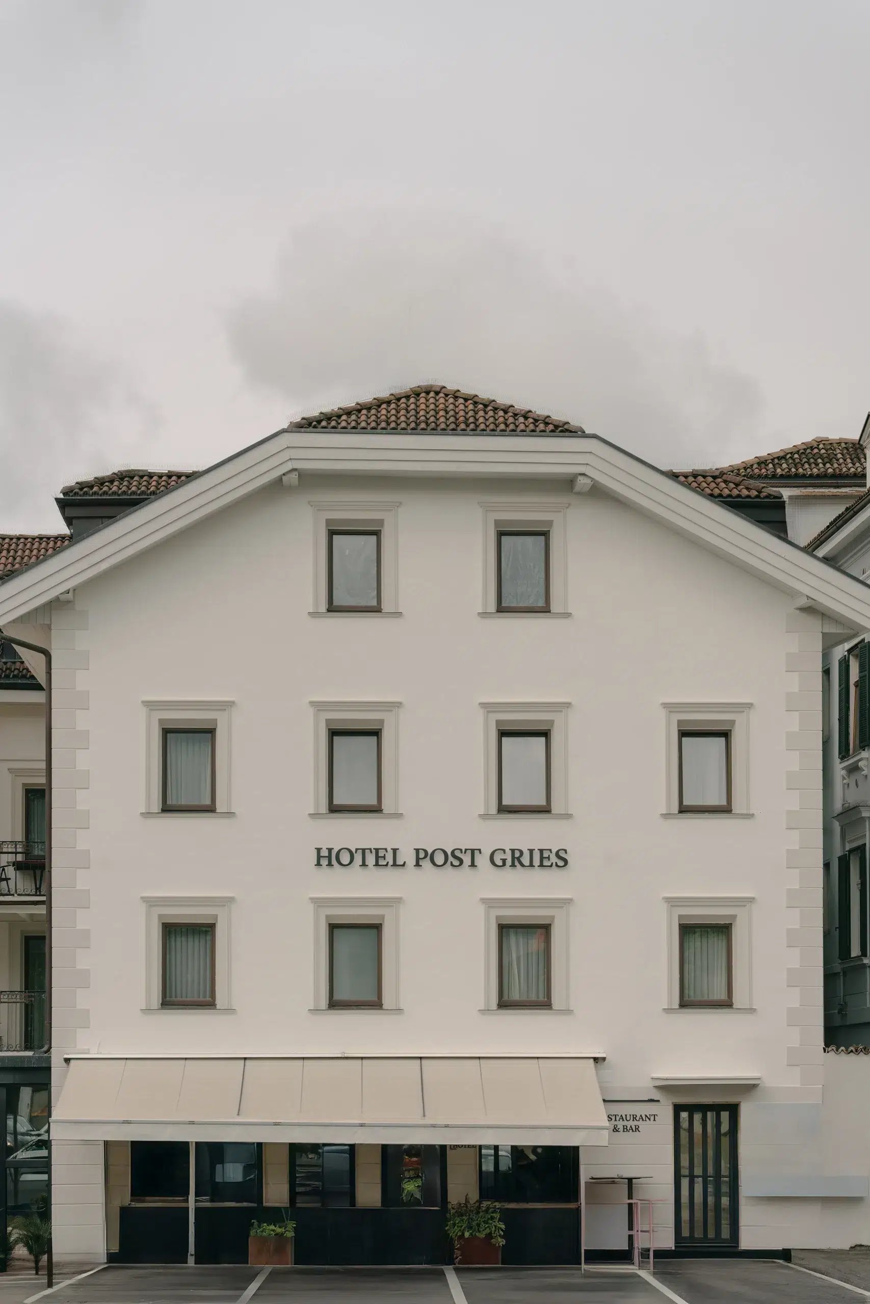 Hotel Post Gries facade design as part of the brand identity refresh for the old post accommodation