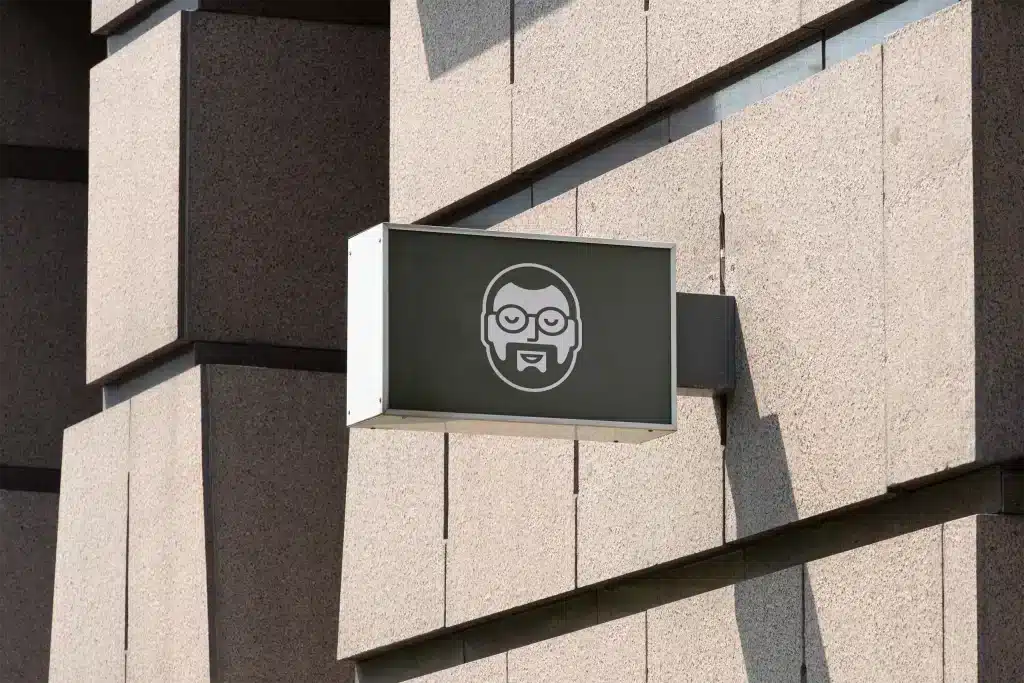 Markenidentität für einen Blumenverleih—Beschilderung für die Lagergarage von „Office Flower Solutions“ mit einem illustrierten Porträt des Gründers.