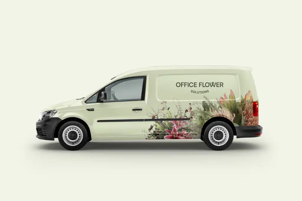 Floral brand identity for Office Flower Solutions — van signage design featuring cut-out bouquets and the brand logo.