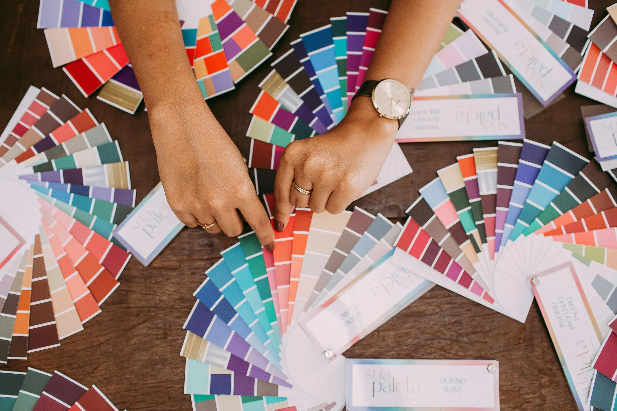 A table full of colour fans—an introduction into an article on the pitfalls of choosing brand colours
