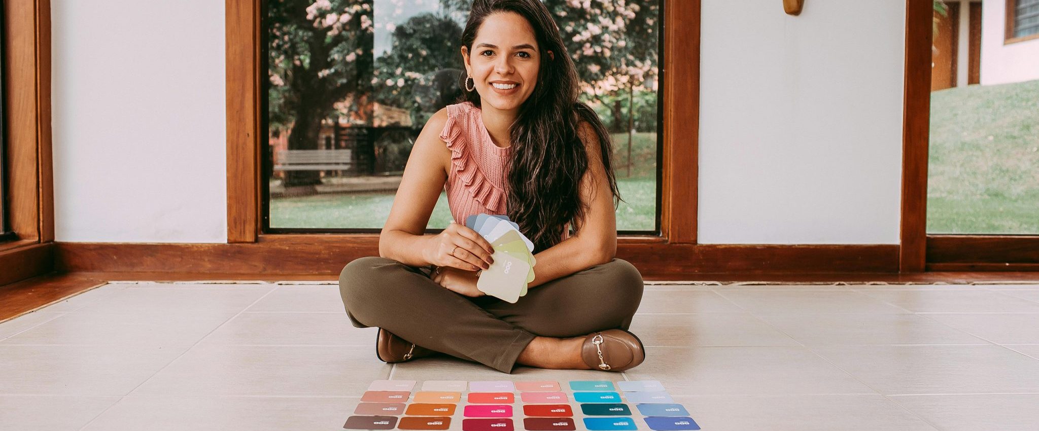A woman selecting brand colours. This is an intro to my article "How many colours should a brand have"