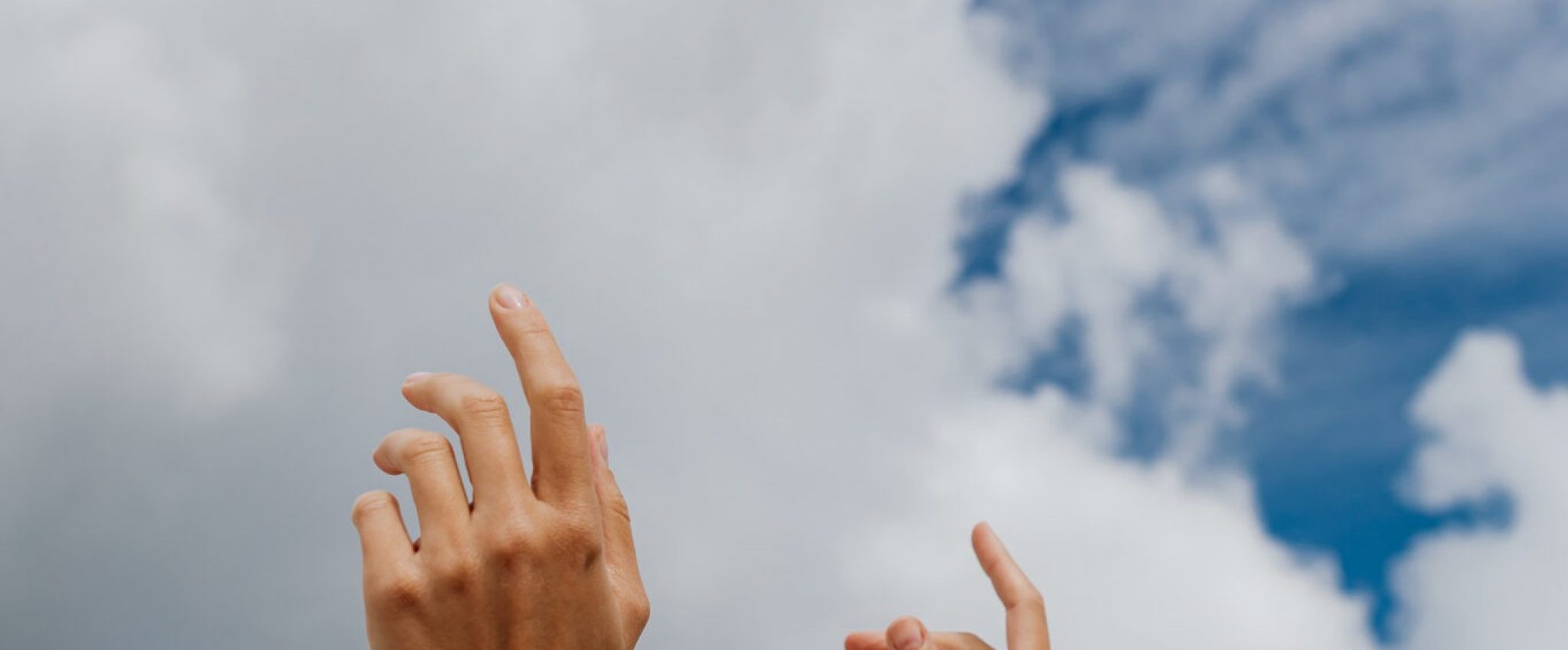 Image shows hands in front of the sky that evoke a certain vibe as a metaphor for brand culture